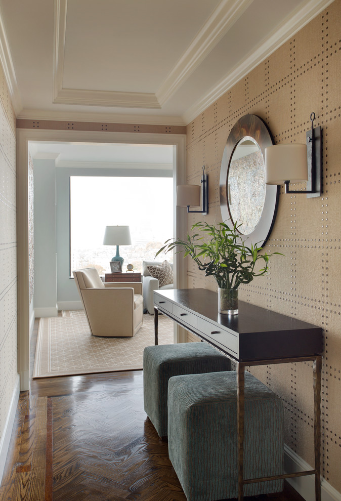 Inspiration for a small timeless medium tone wood floor entry hall remodel in Boston with beige walls