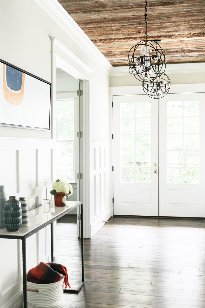 Photo of a medium sized rural foyer in DC Metro with grey walls, dark hardwood flooring, a double front door, a white front door and brown floors.