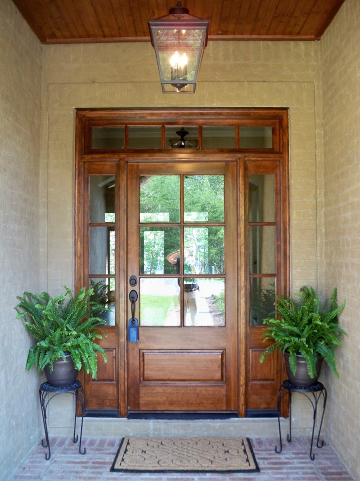 Photo of a medium sized traditional front door in Other with a single front door and a brown front door.