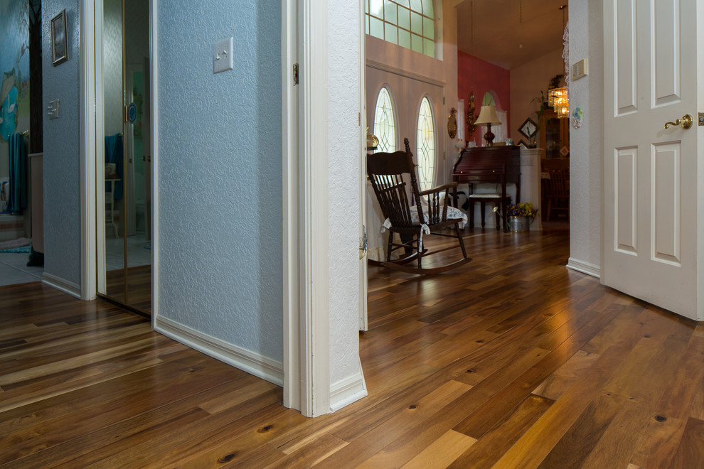 Photo of a medium sized classic foyer in Orlando with light hardwood flooring, a double front door and a white front door.