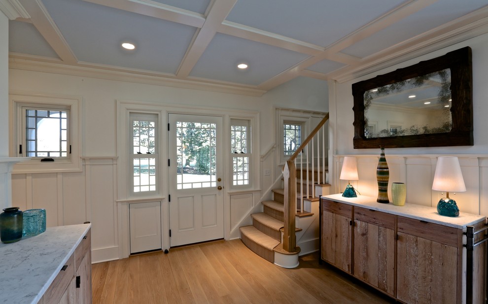 This is an example of a large classic front door in New York with a white front door.