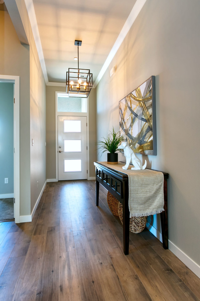 Small transitional laminate floor entryway photo in Seattle with gray walls and a white front door