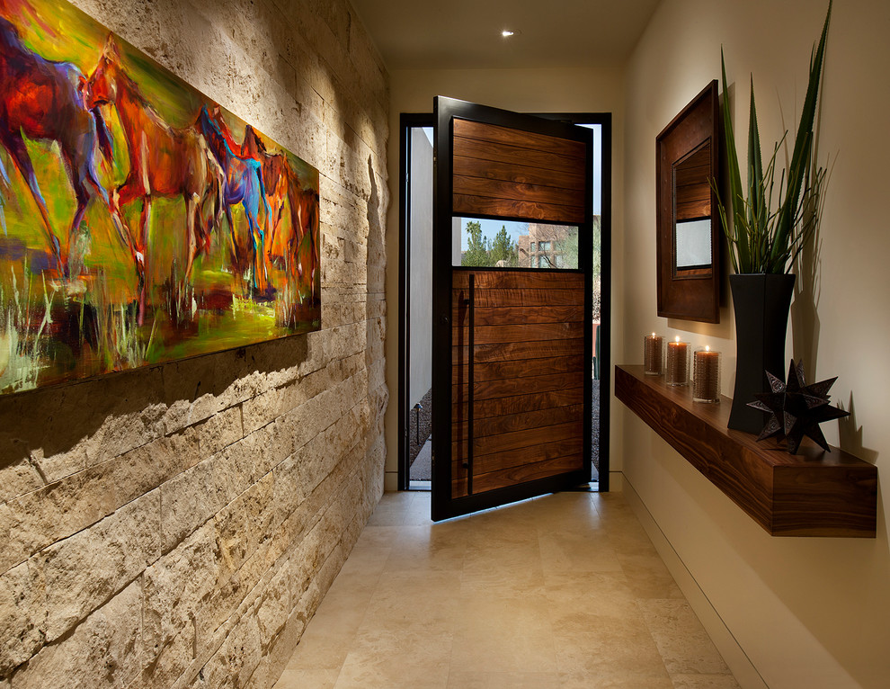 Idée de décoration pour une entrée sud-ouest américain avec un couloir, un mur beige, une porte pivot, une porte en bois foncé et un sol beige.