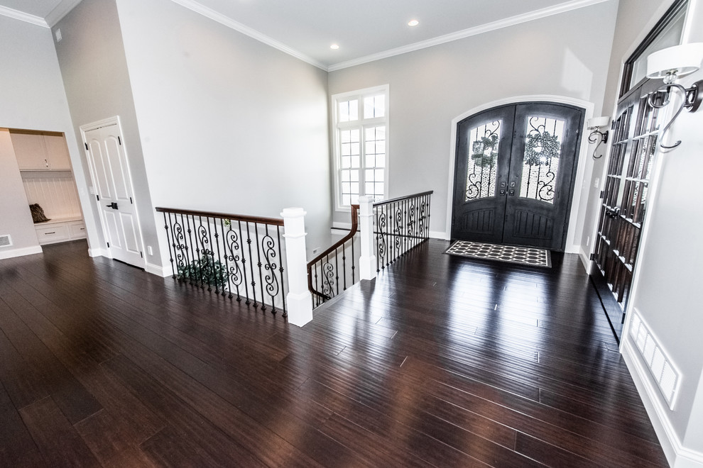 Photo of an entrance in Baltimore with bamboo flooring and brown floors.