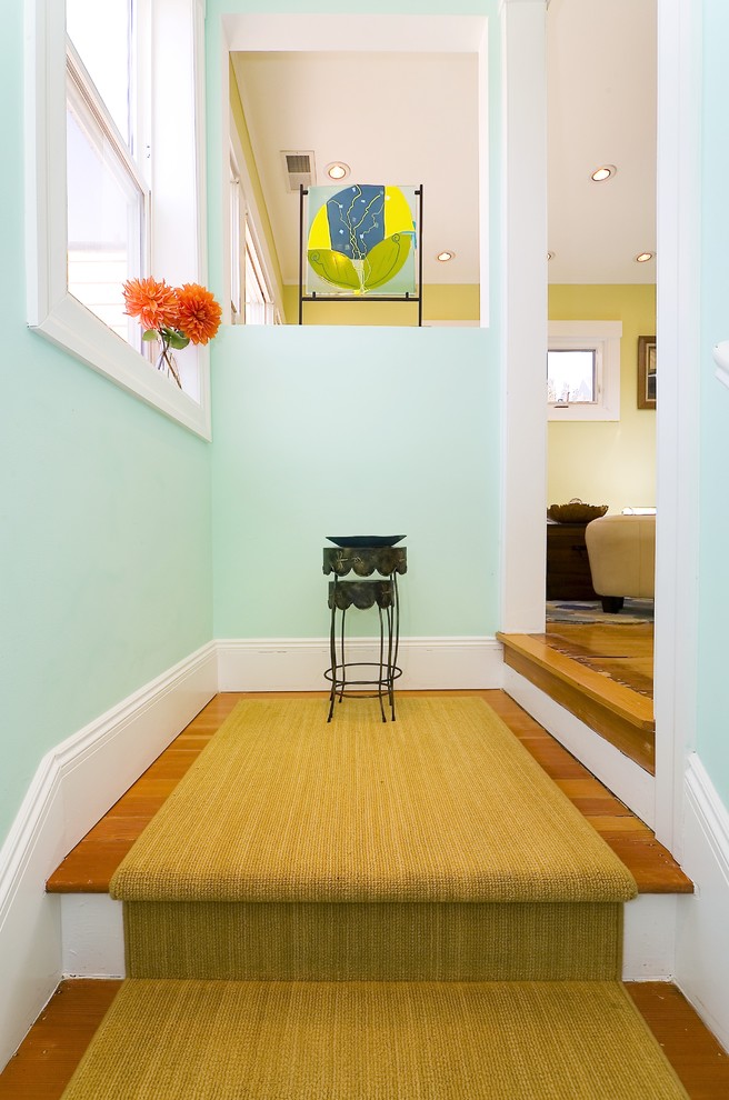 Example of a trendy medium tone wood floor entryway design in San Francisco with blue walls