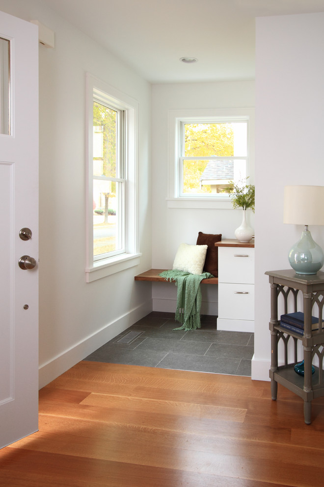 Trendy entryway photo in Minneapolis with white walls