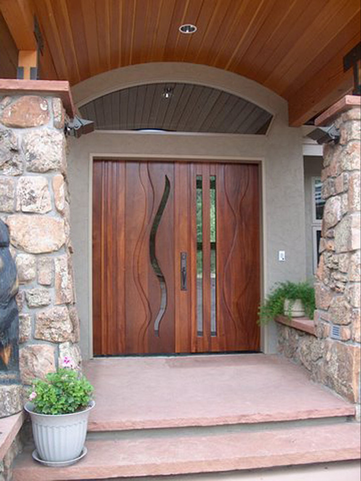 Inspiration for a large transitional entryway remodel in Denver with beige walls and a dark wood front door
