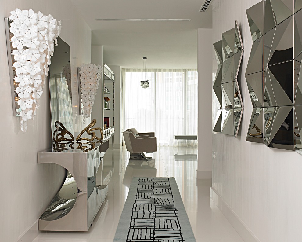Medium sized contemporary hallway in Miami with white walls and porcelain flooring.