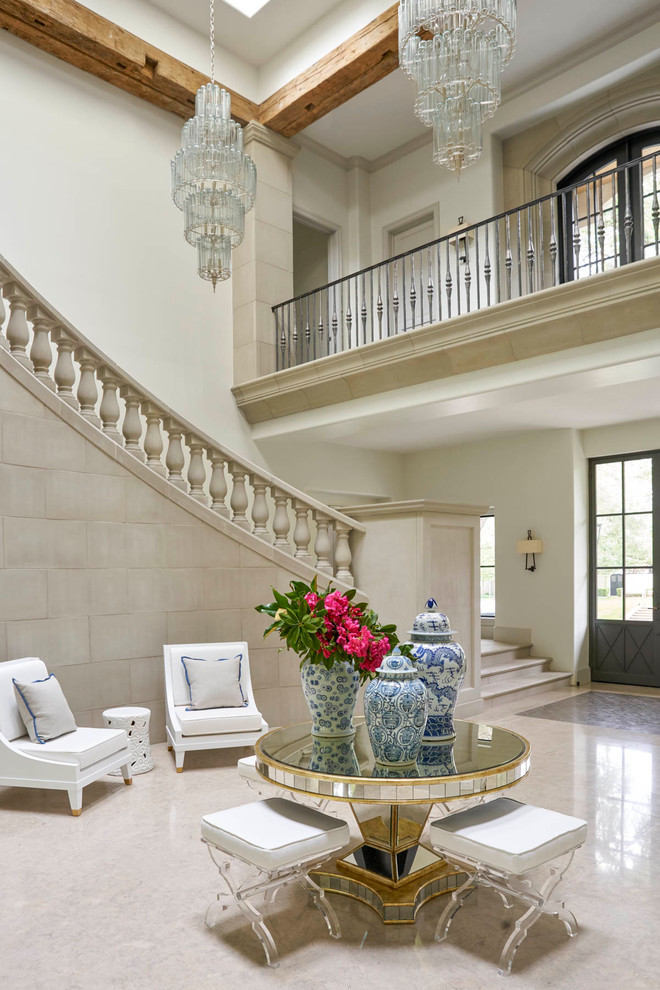 This is an example of a mediterranean foyer in Dallas with white walls and a black front door.