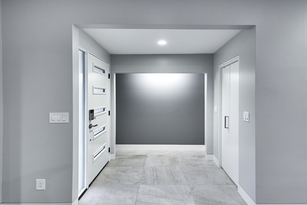 Medium sized contemporary front door in San Francisco with grey walls, porcelain flooring, a single front door, a red front door and grey floors.