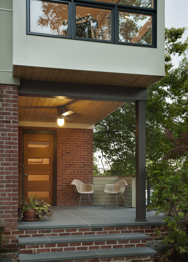 Inspiration for a contemporary front door in DC Metro with a single front door.