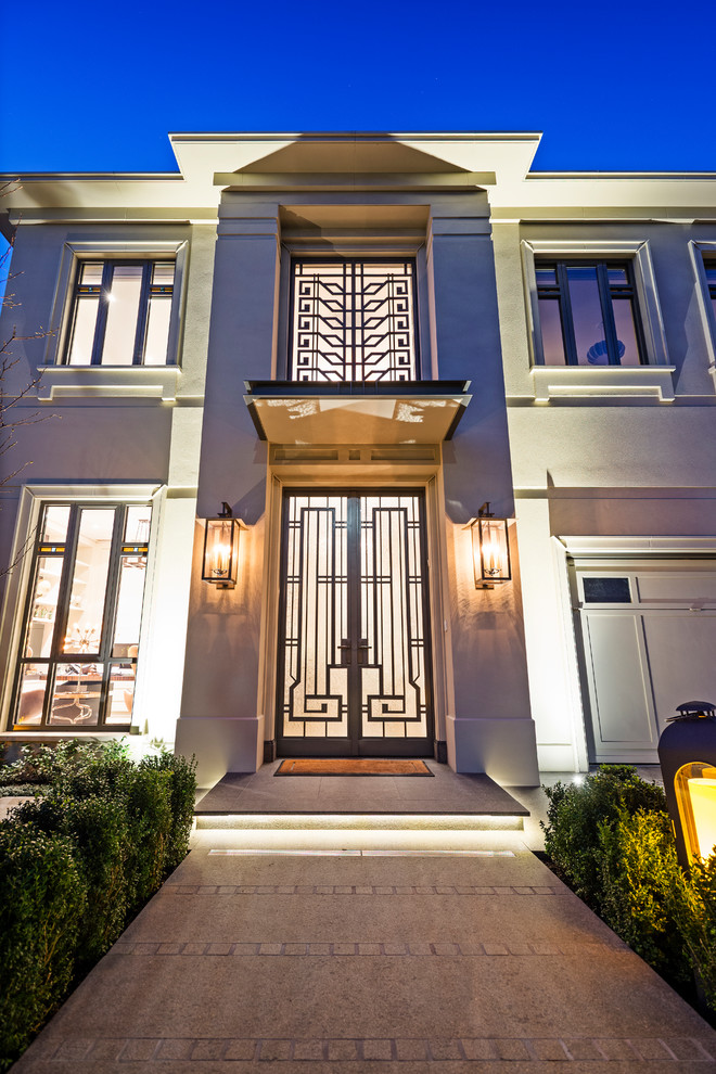 Photo of a large front door in Melbourne with a double front door, a glass front door and beige floors.