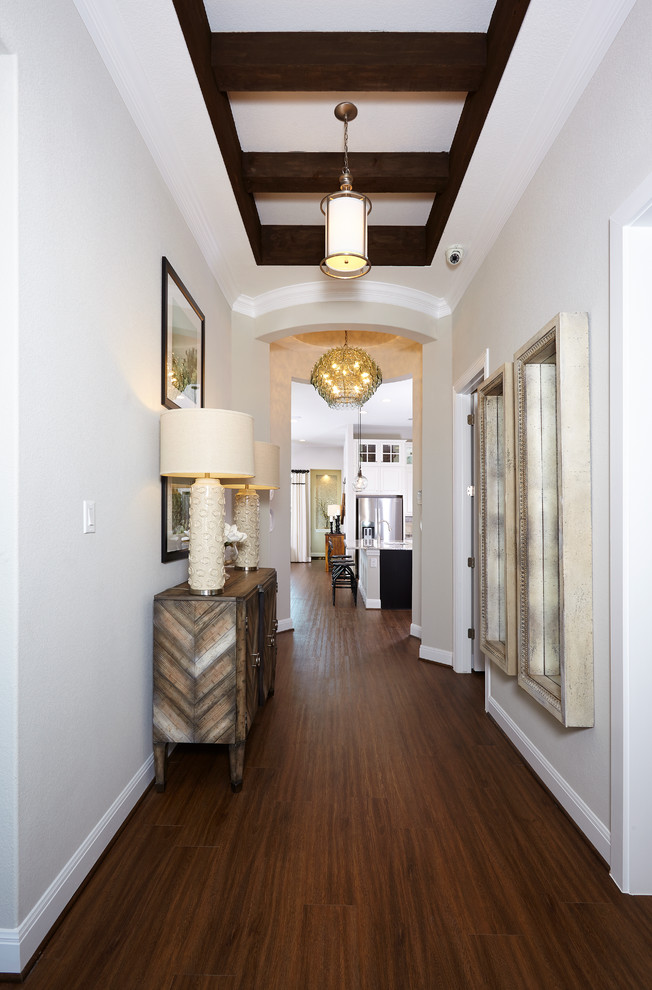 Design ideas for a medium sized rustic hallway in Dallas with white walls, medium hardwood flooring, a single front door, a dark wood front door and brown floors.