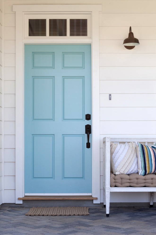 Entryway - large farmhouse entryway idea in Los Angeles with a blue front door