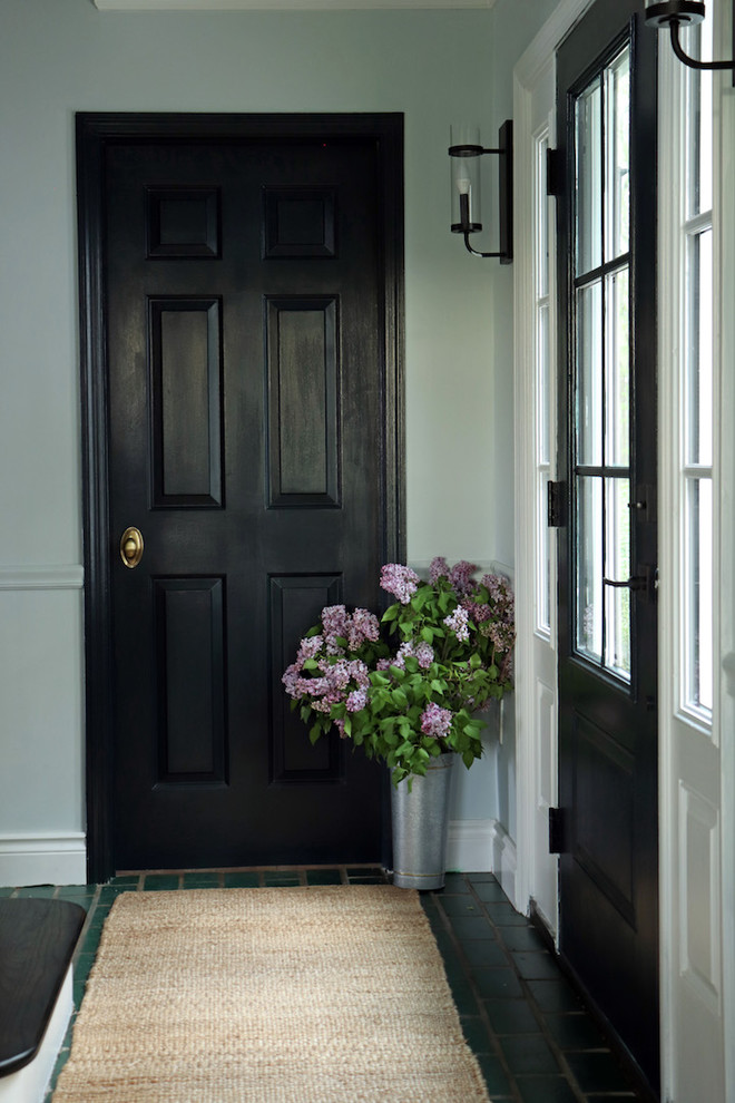 Design ideas for a small classic front door in New York with grey walls, medium hardwood flooring, a single front door, a dark wood front door, brown floors and a dado rail.