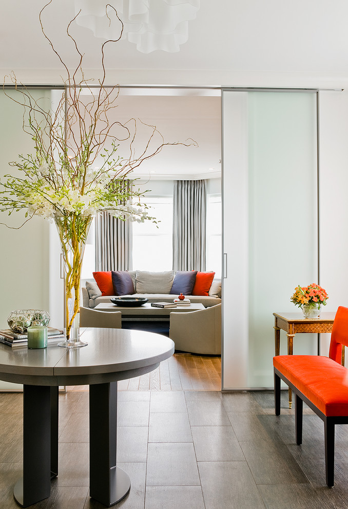 Example of a trendy gray floor foyer design in Boston with white walls