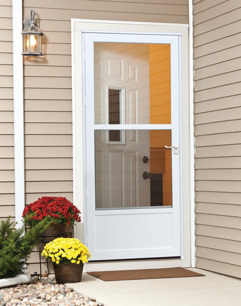 Example of an entryway design in Other with a white front door