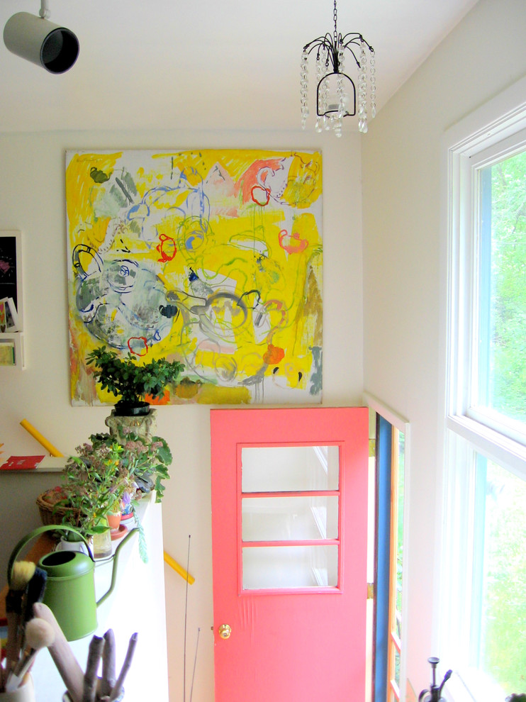 Example of an eclectic entryway design in Burlington with white walls