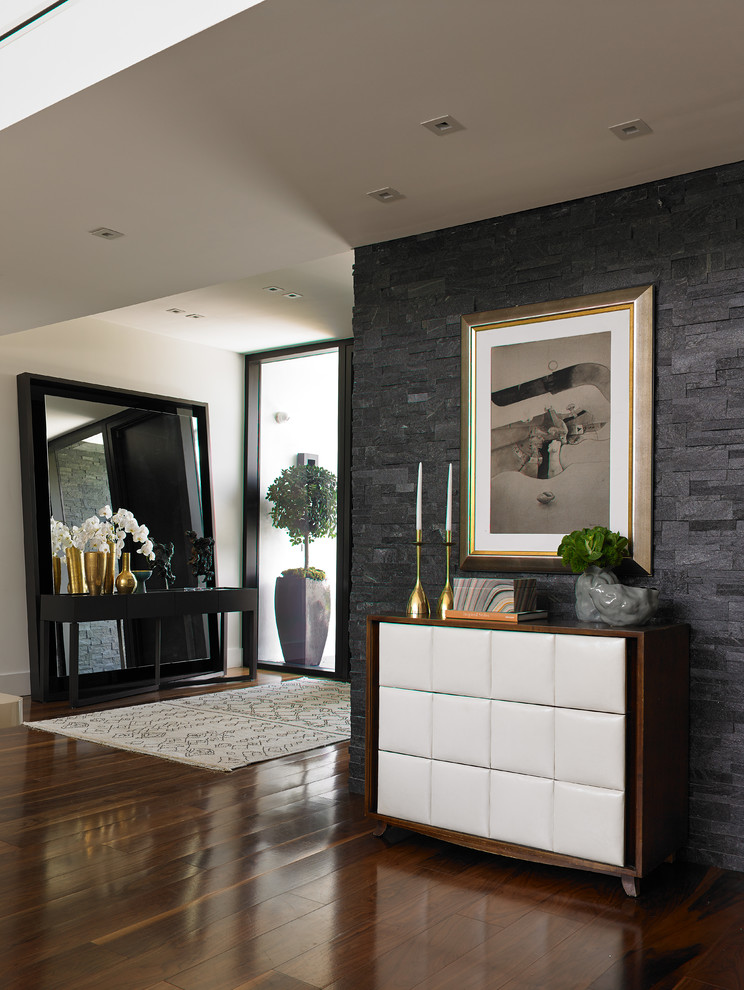 Inspiration for a large modern foyer in Miami with a double front door.