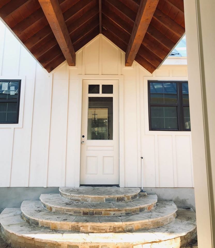 Inspiration for a medium sized farmhouse front door in Austin with white walls, a single front door and a white front door.