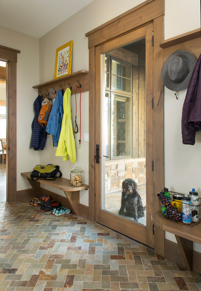 Mid-sized minimalist slate floor and multicolored floor mudroom photo in Denver with beige walls