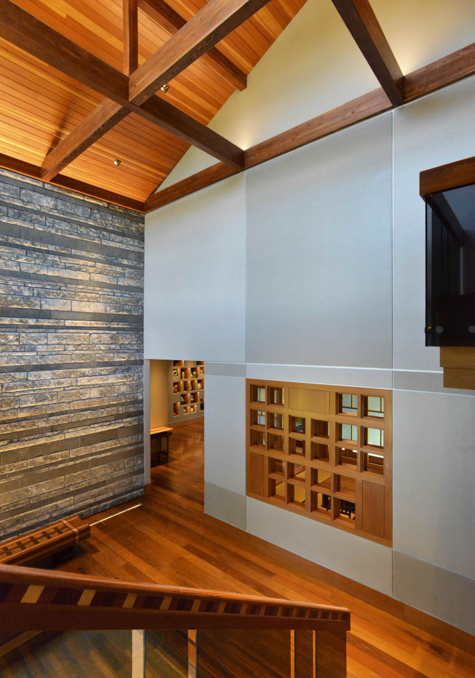 Großes Modernes Foyer mit grauer Wandfarbe, braunem Holzboden, Doppeltür, schwarzer Haustür, beigem Boden und Holzdecke in Austin