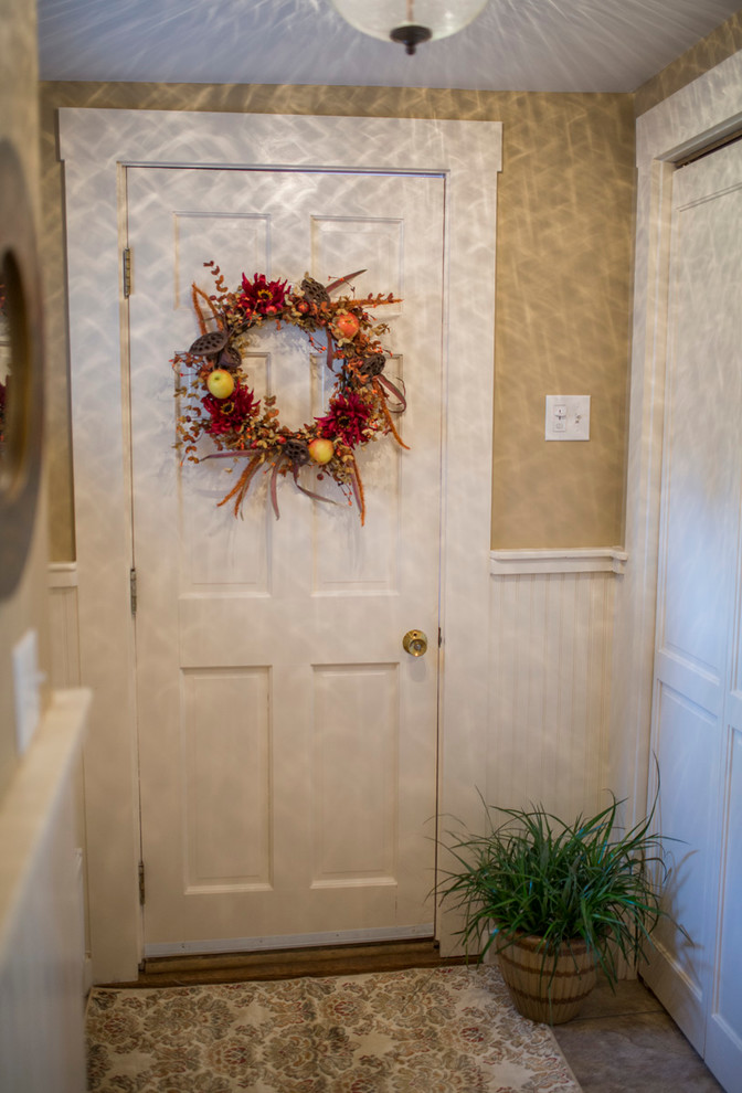 Cottage chic entryway photo in Boston with a white front door