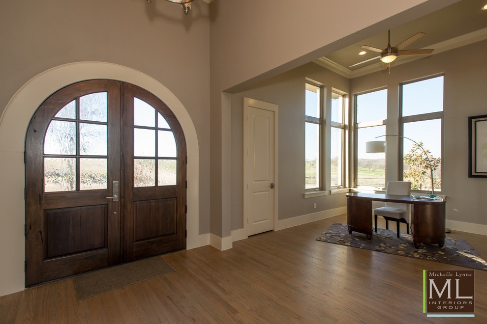 Design ideas for a large classic front door in Dallas with grey walls, medium hardwood flooring, a double front door and a dark wood front door.