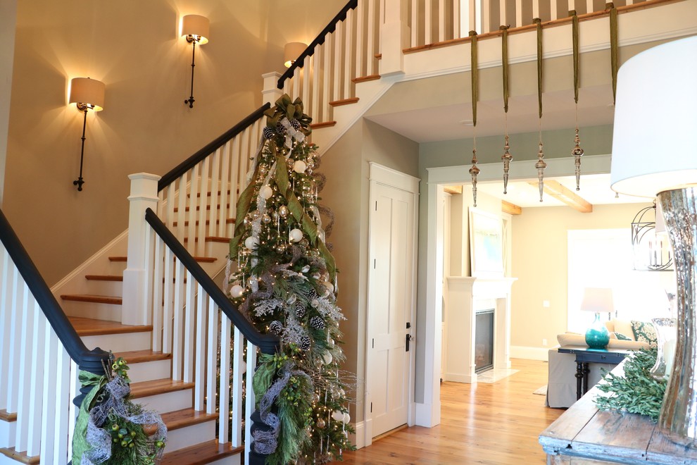 Example of a large cottage medium tone wood floor entryway design in Other with gray walls and a medium wood front door