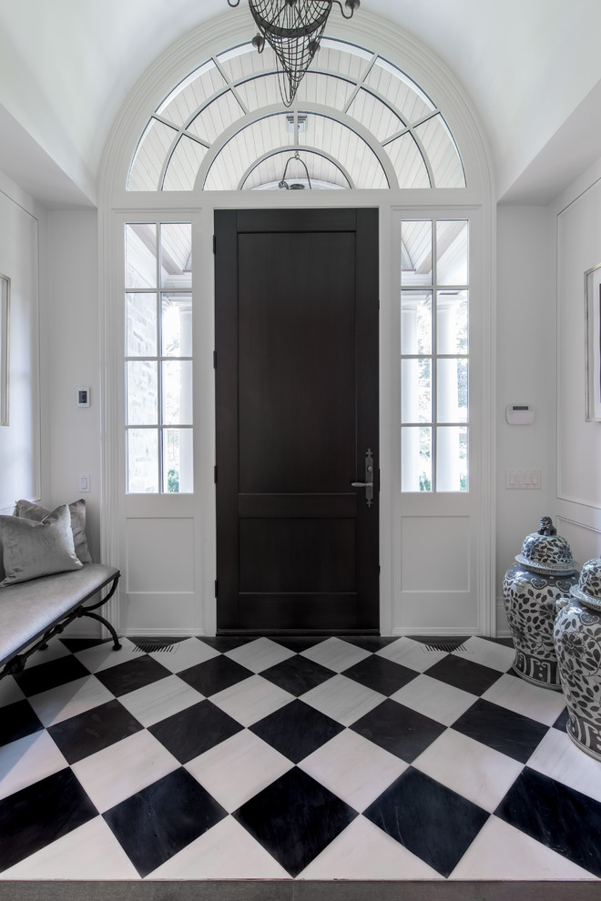 Entryway - mid-sized transitional ceramic tile and black floor entryway idea in Other with white walls and a dark wood front door