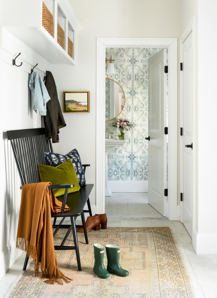 Inspiration for a medium sized traditional hallway in Boston with a single front door, grey walls and grey floors.