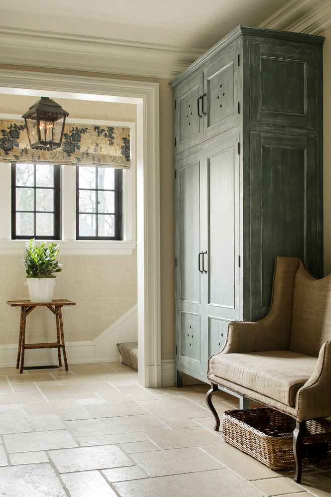 Traditional entrance in New York with beige walls and feature lighting.