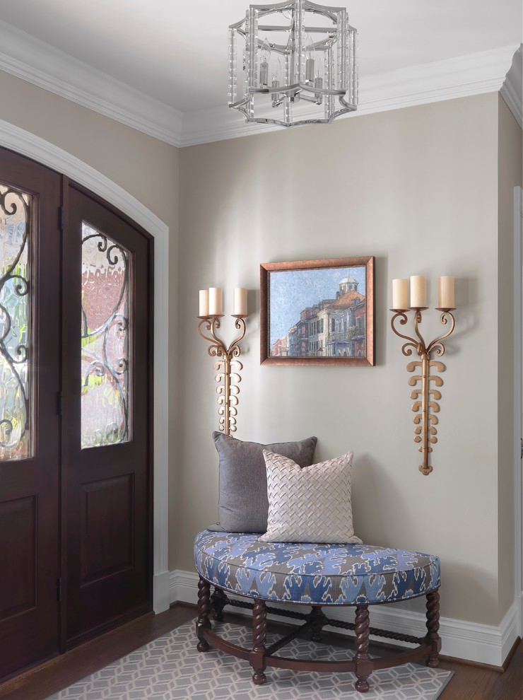 Design ideas for a small traditional foyer in St Louis with beige walls, dark hardwood flooring, a double front door, a dark wood front door and brown floors.