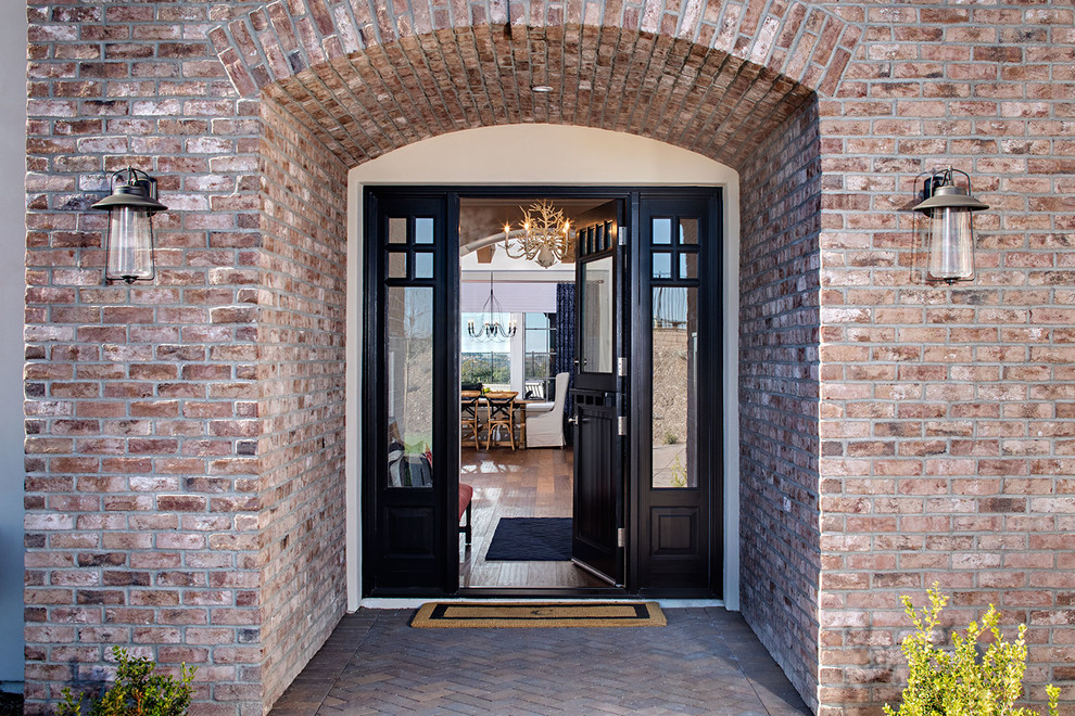 Inspiration for a contemporary entryway remodel in San Diego with a black front door