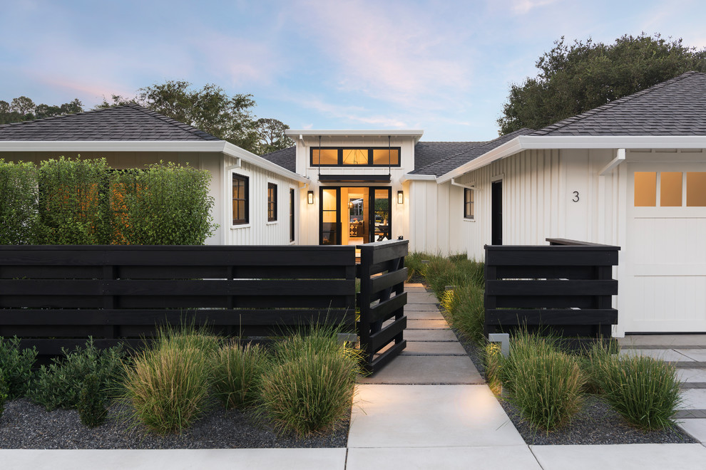 Country front door in San Francisco with white walls, concrete flooring, a single front door, a medium wood front door and grey floors.