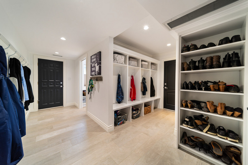 Medium sized classic boot room in Vancouver with white walls, porcelain flooring, a single front door, a black front door and beige floors.