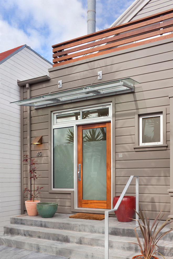 Single front door - contemporary single front door idea in San Francisco with a glass front door