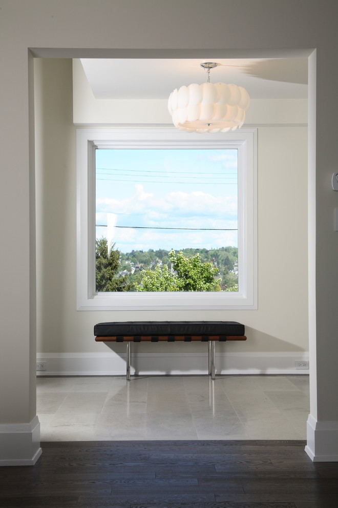 Trendy entryway photo in Vancouver with beige walls