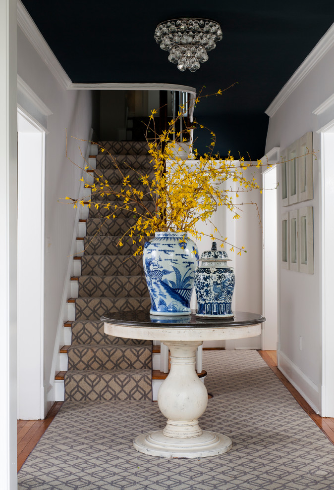 Inspiration for a medium sized classic foyer in DC Metro with white walls and medium hardwood flooring.