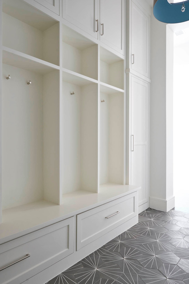 Example of a mid-sized transitional mudroom design in Dallas with white walls