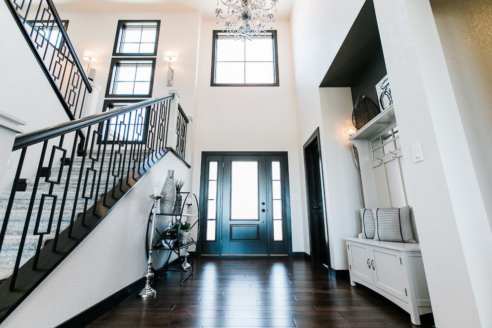 Mid-sized transitional dark wood floor and brown floor entryway photo in Other with white walls and a dark wood front door