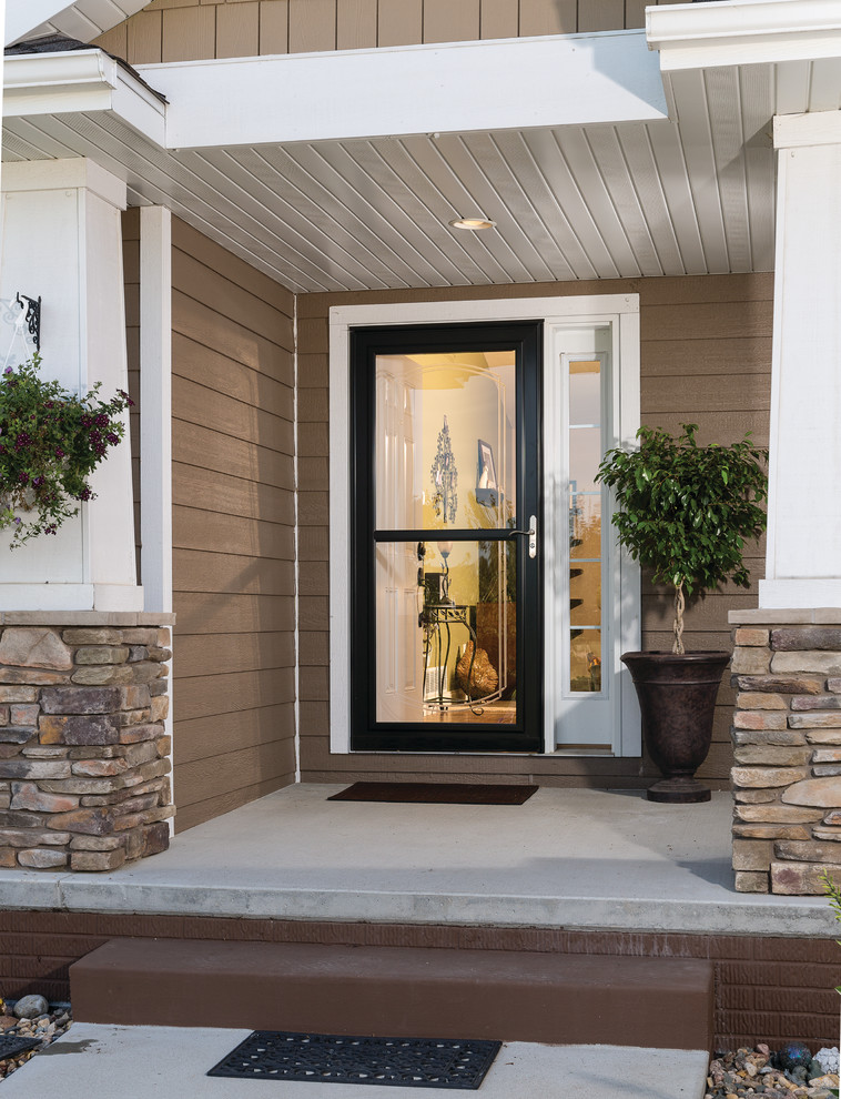 Example of an arts and crafts entryway design in Other with a black front door