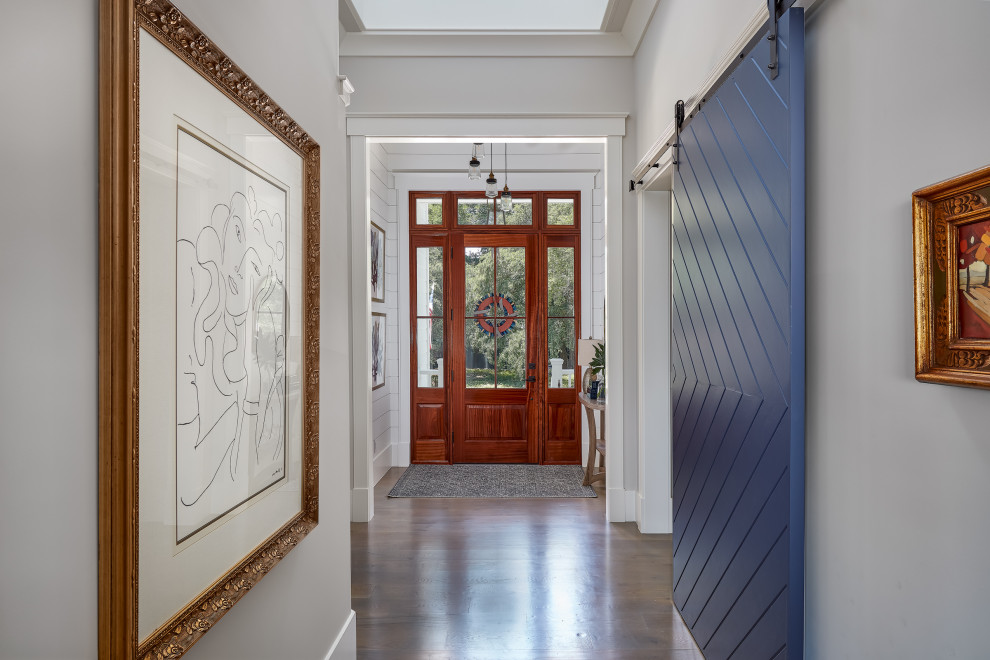 Entryway - large coastal brown floor entryway idea in Charleston with gray walls and a dark wood front door