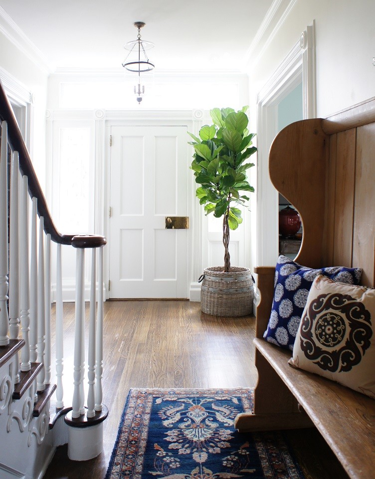 Photo of a medium sized classic entrance in New York with white walls, medium hardwood flooring, a single front door and a white front door.