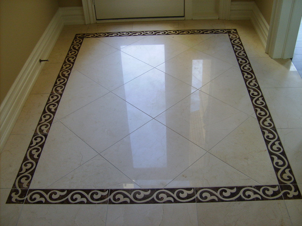 Mid-sized elegant porcelain tile entryway photo in Toronto with beige walls and a white front door