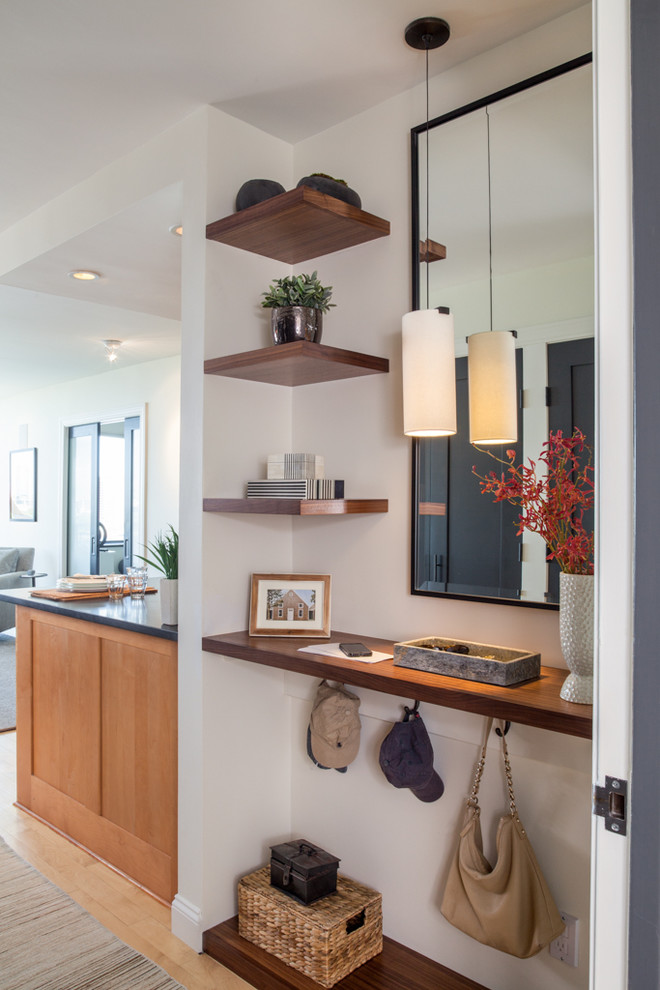 Inspiration for a small transitional light wood floor foyer remodel in Boston with beige walls