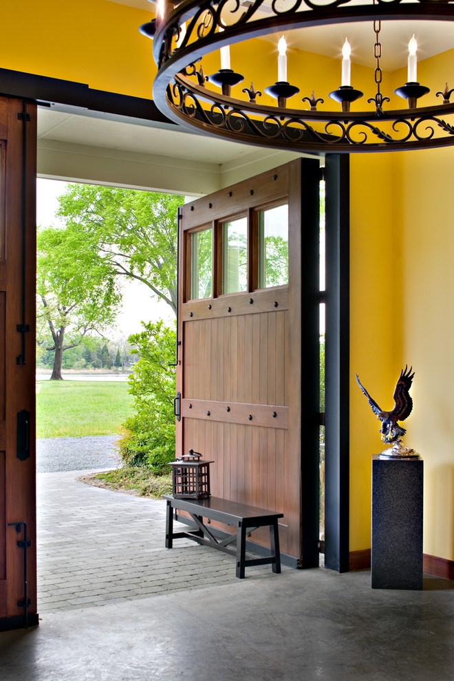 Example of a trendy concrete floor entryway design in Baltimore