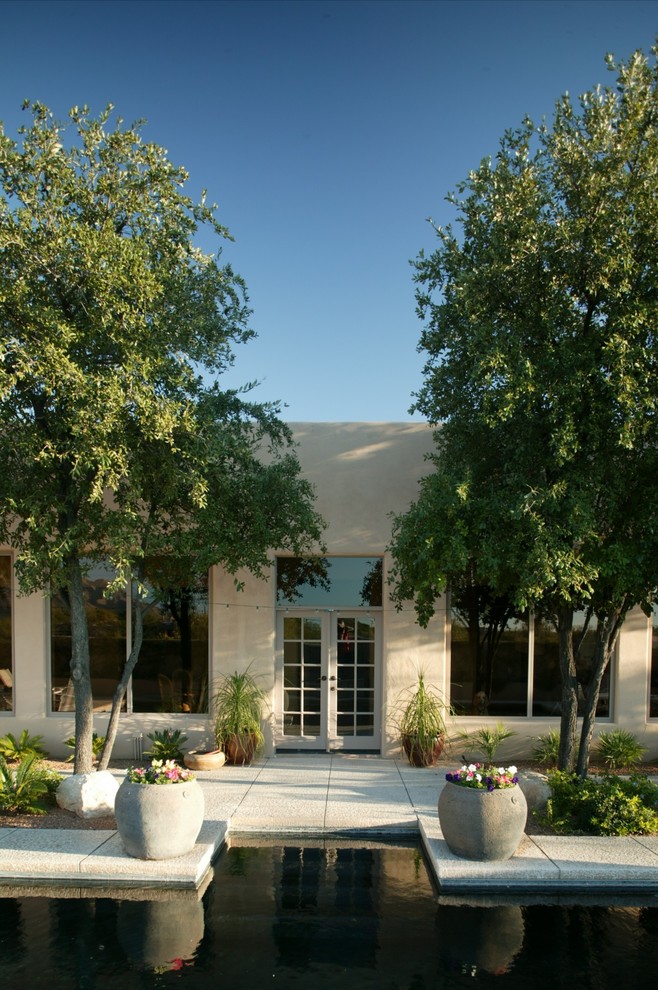 Mediterranean entrance in Phoenix with a double front door and a glass front door.