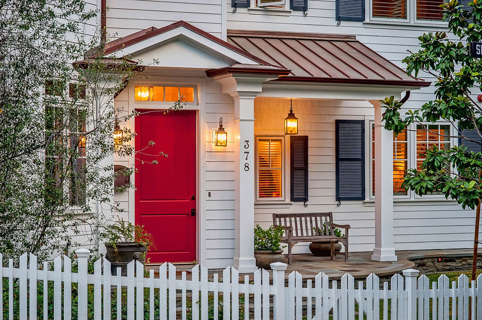 Photo of a classic porch in Los Angeles with a red front door and feature lighting.