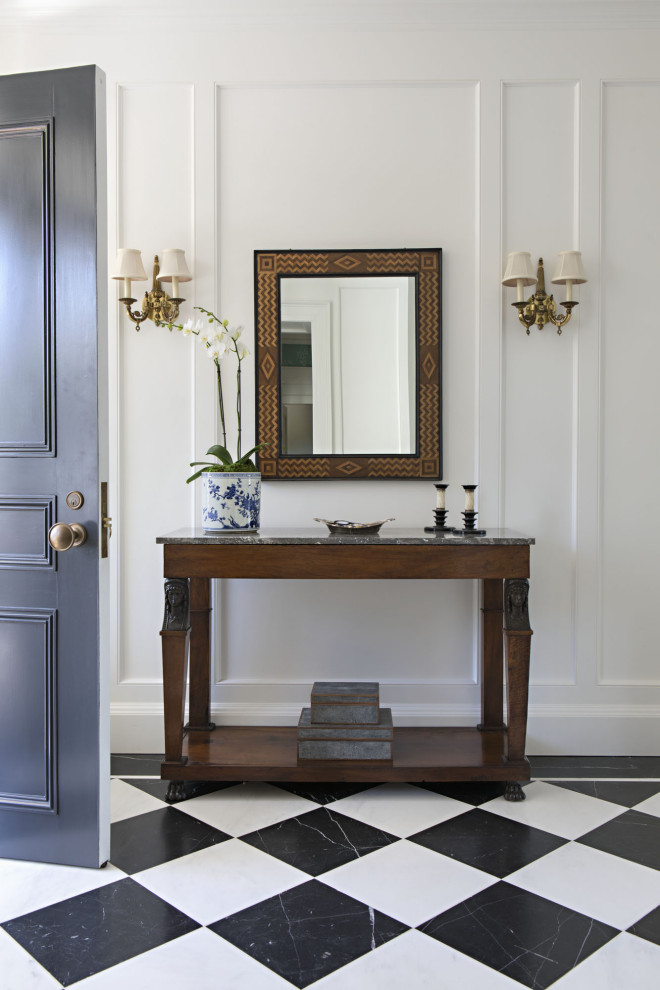 Photo of a medium sized traditional hallway in Los Angeles with white walls, a single front door, a black front door and multi-coloured floors.